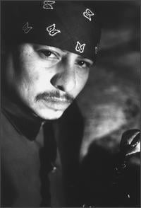 This is the Avatar Image for the T-Bone Mendez (Arturo Raymond. - Grand Theft Auto: San Andreas / GTA) AI Voice and Text to Speech Generator